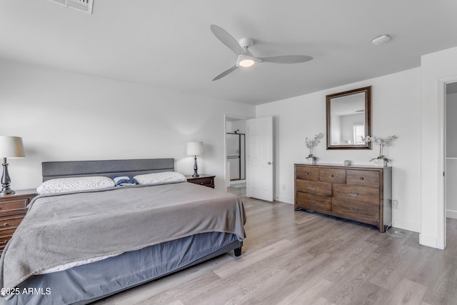 bedroom with baseboards, a ceiling fan, and wood finished floors