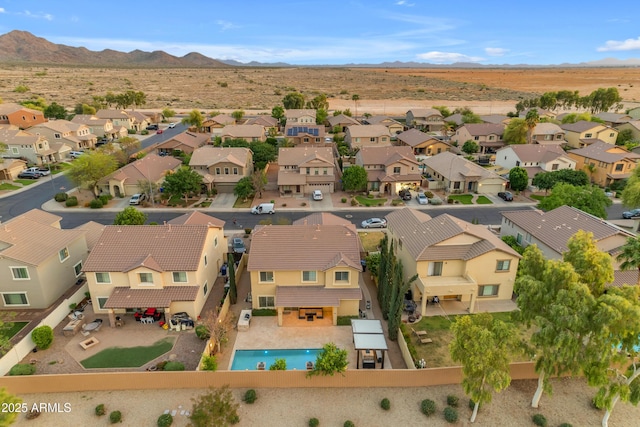 aerial view with a mountain view and a residential view