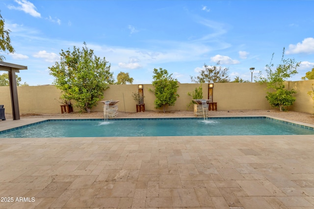 view of swimming pool with a patio, a fenced backyard, and a fenced in pool