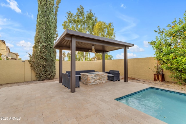 view of swimming pool with a patio area, a fenced backyard, a fenced in pool, and a fire pit