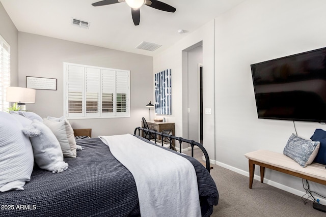 carpeted bedroom featuring baseboards, visible vents, and ceiling fan