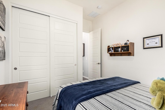 carpeted bedroom featuring a closet