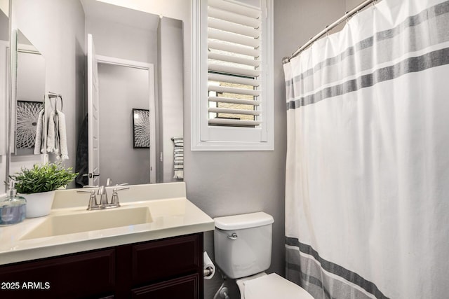 full bathroom featuring toilet and vanity