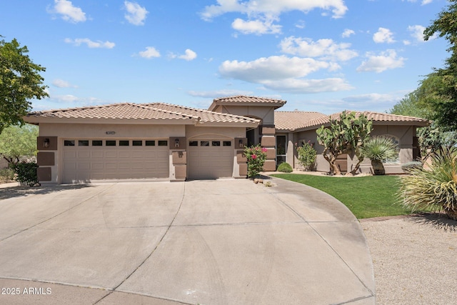 31234 N 47th Pl, Cave Creek, AZ 85331 - mediterranean / spanish home featuring a garage, driveway, stucco siding, a front yard, and a tile roof