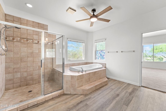 31234 N 47th Pl, Cave Creek, AZ 85331 - full bathroom featuring wood finished floors, a bath, a shower stall, ceiling fan, and recessed lighting