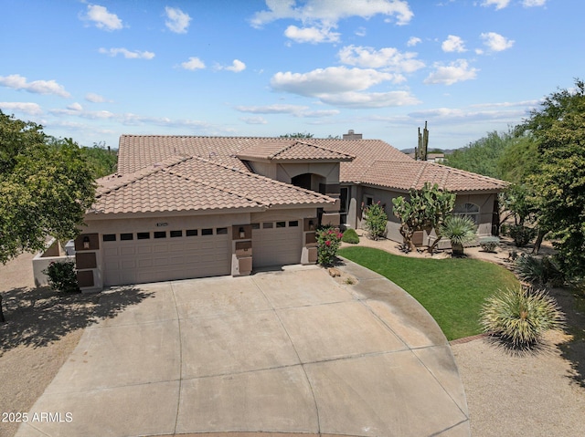 31234 N 47th Pl, Cave Creek, AZ 85331 - mediterranean / spanish-style house featuring an attached garage, driveway, a tile roof, stucco siding, and a front lawn