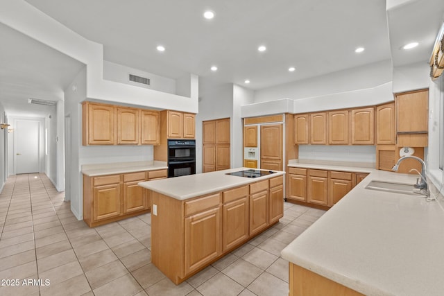 31234 N 47th Pl, Cave Creek, AZ 85331 - kitchen with a center island, light tile patterned flooring, black appliances, light countertops, and recessed lighting