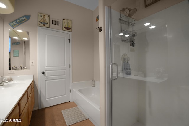 19519 W Minnezona Ave, Litchfield Park, AZ 85340 - bathroom featuring visible vents, a bath, a stall shower, and vanity