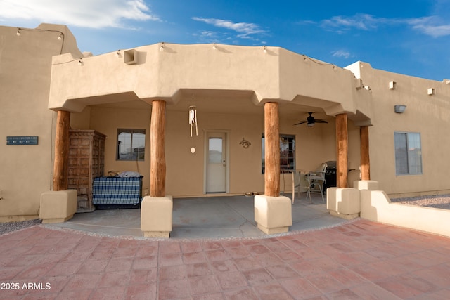 19519 W Minnezona Ave, Litchfield Park, AZ 85340 - rear view of house with a ceiling fan, a patio, and stucco siding