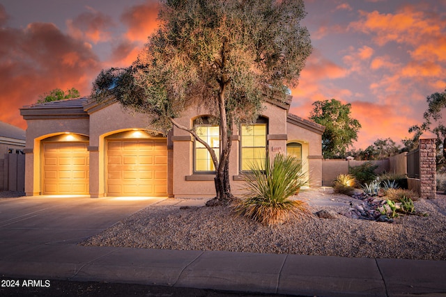 view of front of property with a garage