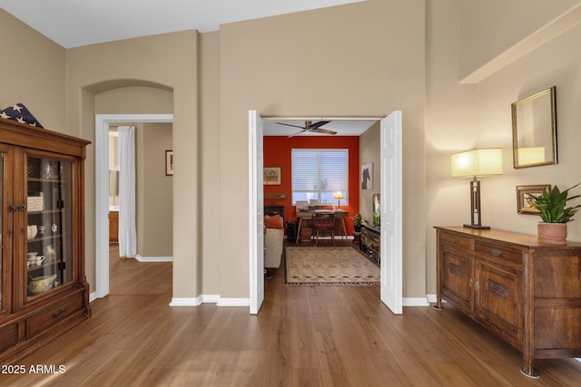 corridor with wood-type flooring