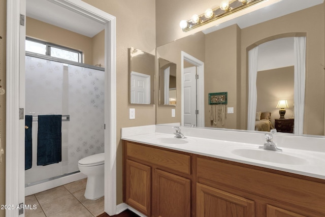 bathroom with tile patterned flooring, an enclosed shower, vanity, and toilet