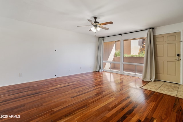 unfurnished room featuring hardwood / wood-style floors and ceiling fan