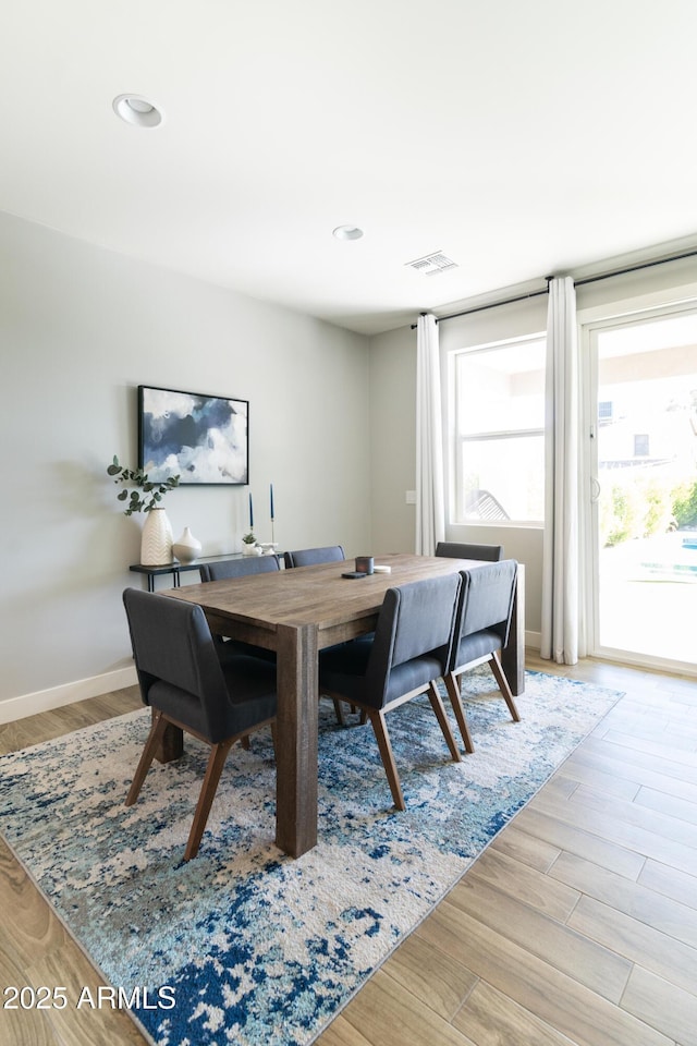 dining space featuring light hardwood / wood-style floors