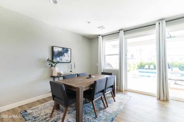 dining space featuring light wood-type flooring