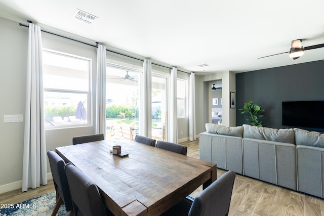 dining space featuring ceiling fan and light hardwood / wood-style flooring