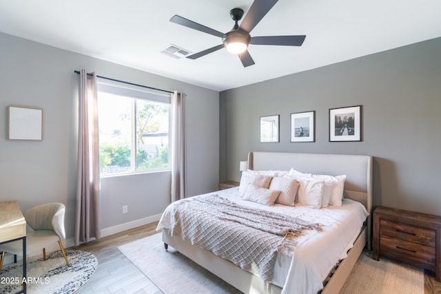 bedroom featuring ceiling fan and light hardwood / wood-style flooring