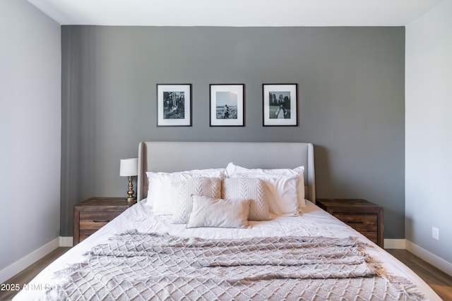 bedroom with hardwood / wood-style flooring