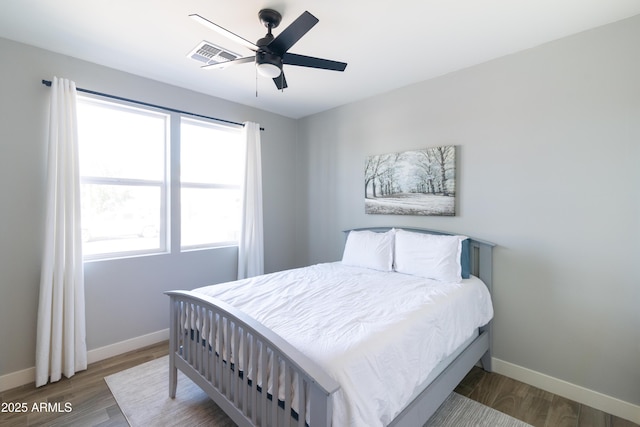 bedroom featuring hardwood / wood-style flooring and ceiling fan