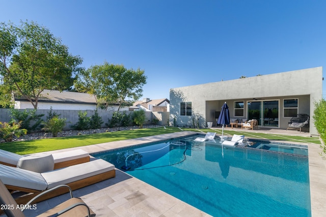 view of pool featuring a patio area and a lawn