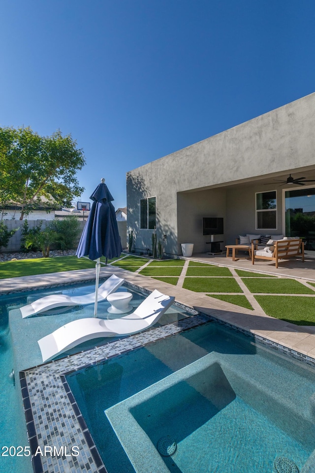 view of swimming pool with an outdoor living space, a patio, and an in ground hot tub