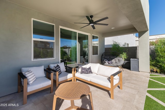 view of patio with an outdoor living space and ceiling fan