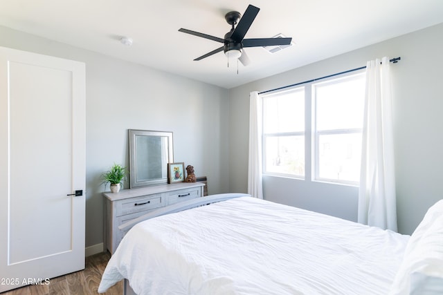 bedroom featuring hardwood / wood-style flooring and ceiling fan