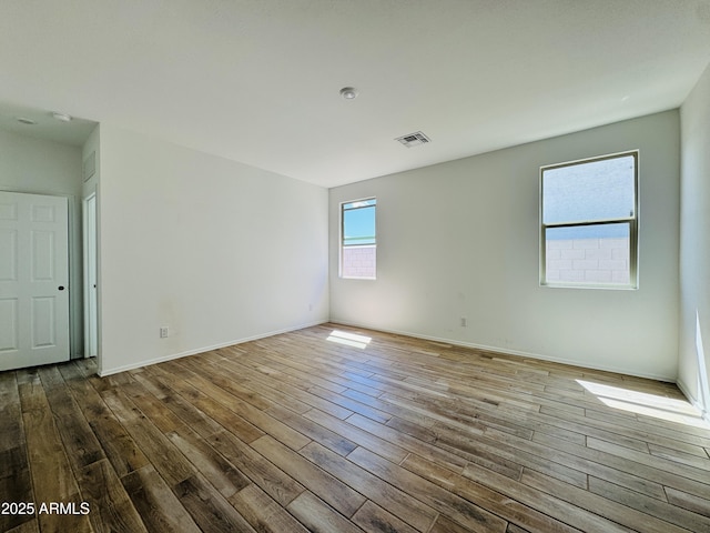 46904 W Coe St, Maricopa, AZ 85139 - spare room with wood finished floors, baseboards, and a smoke detector