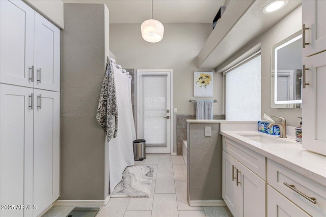 5674 W N Ln, Glendale, AZ 85302 - full bath featuring a tub to relax in, tile patterned flooring, vanity, and a shower with curtain
