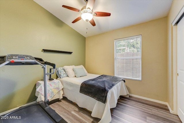 5674 W N Ln, Glendale, AZ 85302 - bedroom with baseboards, wood finished floors, a ceiling fan, and lofted ceiling