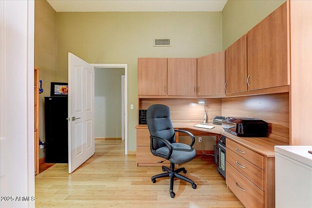 5674 W N Ln, Glendale, AZ 85302 - office featuring light wood-style floors, a high ceiling, and visible vents