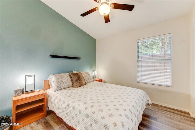 5674 W N Ln, Glendale, AZ 85302 - bedroom with wood finished floors, ceiling fan, baseboards, and vaulted ceiling