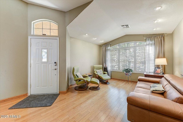 5674 W N Ln, Glendale, AZ 85302 - foyer entrance with visible vents, a wealth of natural light, wood finished floors, and lofted ceiling