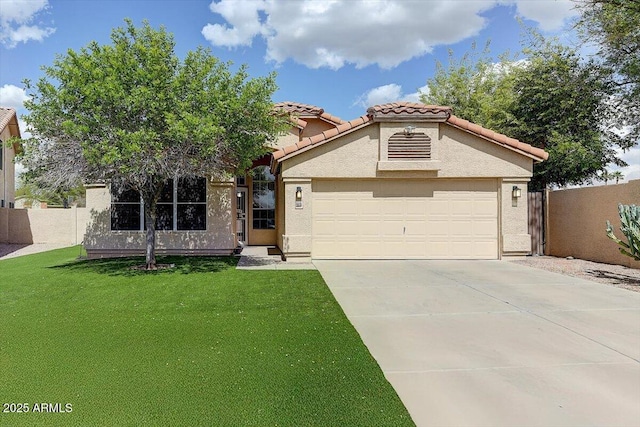 5674 W N Ln, Glendale, AZ 85302 - view of front of property with a tiled roof, stucco siding, a front yard, an attached garage, and concrete driveway