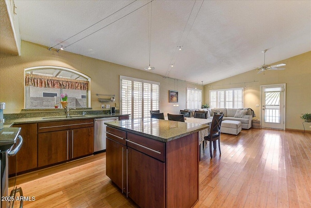 5674 W N Ln, Glendale, AZ 85302 - kitchen with a sink, stainless steel dishwasher, light wood finished floors, and a wealth of natural light