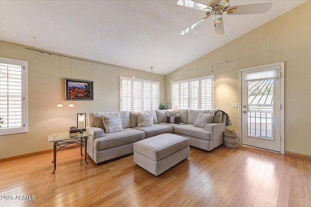5674 W N Ln, Glendale, AZ 85302 - living room featuring baseboards, light wood finished floors, ceiling fan, and lofted ceiling