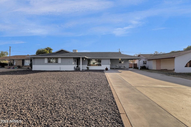 ranch-style house featuring a carport