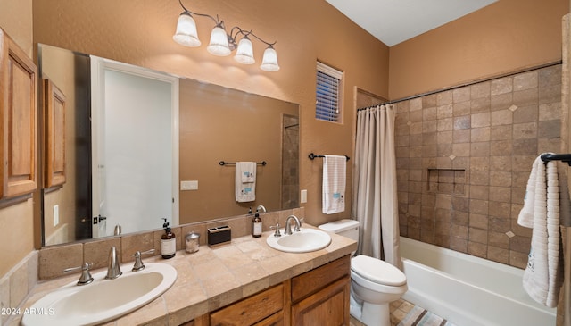 full bathroom with shower / tub combo, vanity, and toilet