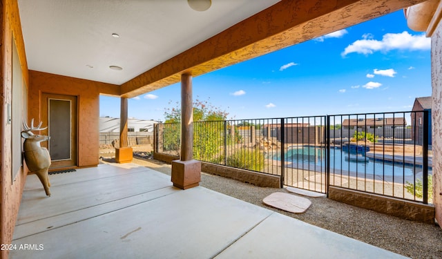 view of patio / terrace with a fenced in pool