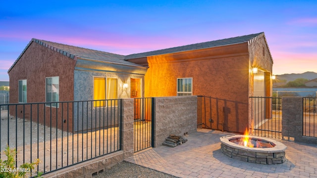 view of front of home with a fire pit