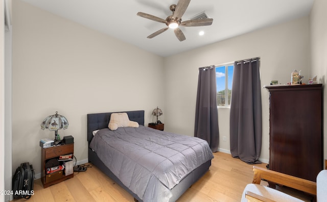 bedroom featuring light wood-type flooring and ceiling fan