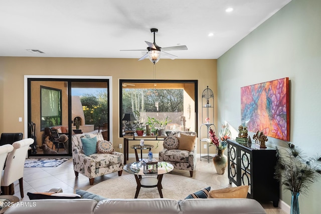 living room featuring ceiling fan and light tile patterned floors