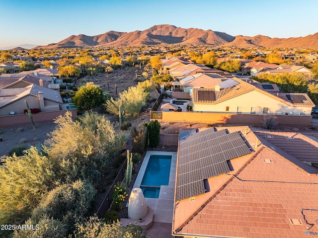 birds eye view of property featuring a mountain view