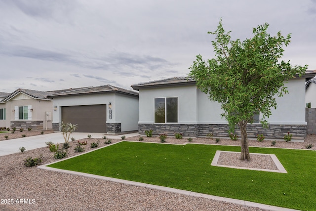 view of front of home with a front lawn and a garage