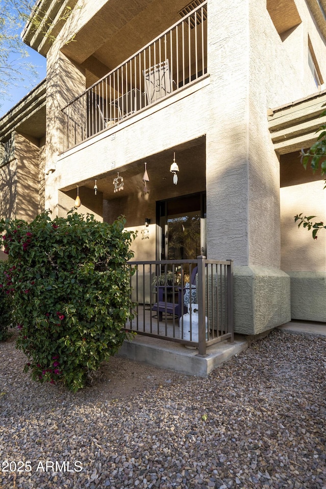 doorway to property featuring a balcony