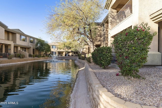 view of property's community featuring a water view