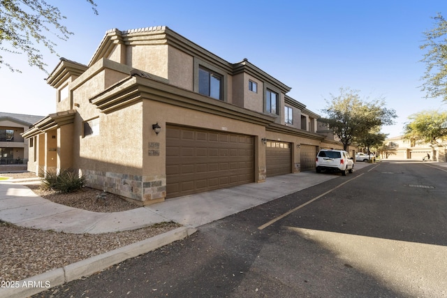 view of side of home with a garage