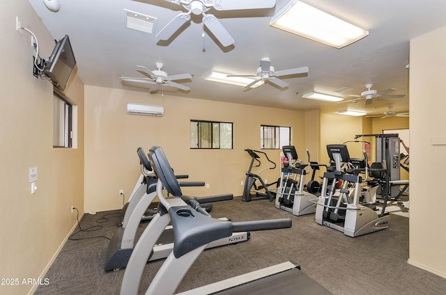 exercise room featuring a wall mounted AC and carpet floors