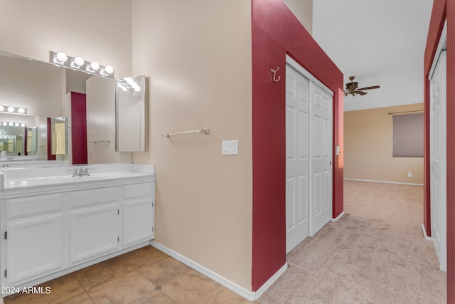 bathroom with tile patterned floors, ceiling fan, and vanity