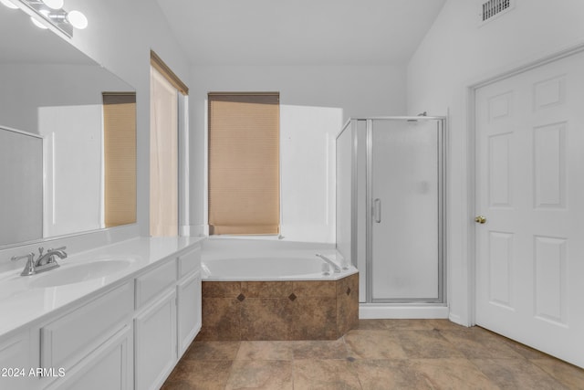 bathroom featuring separate shower and tub and vanity